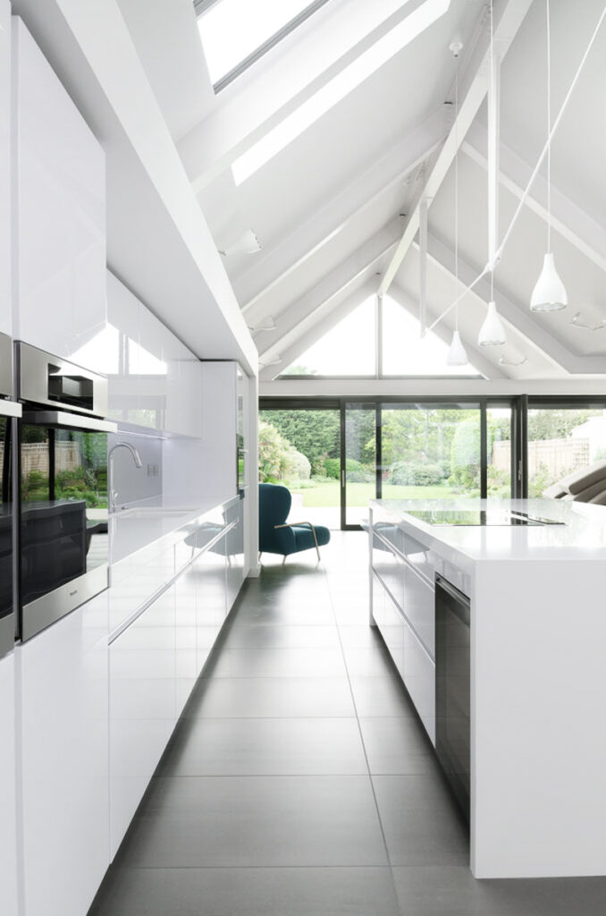 Interior view of the kitchen looking out to the garden at at Stoke House in Bristol