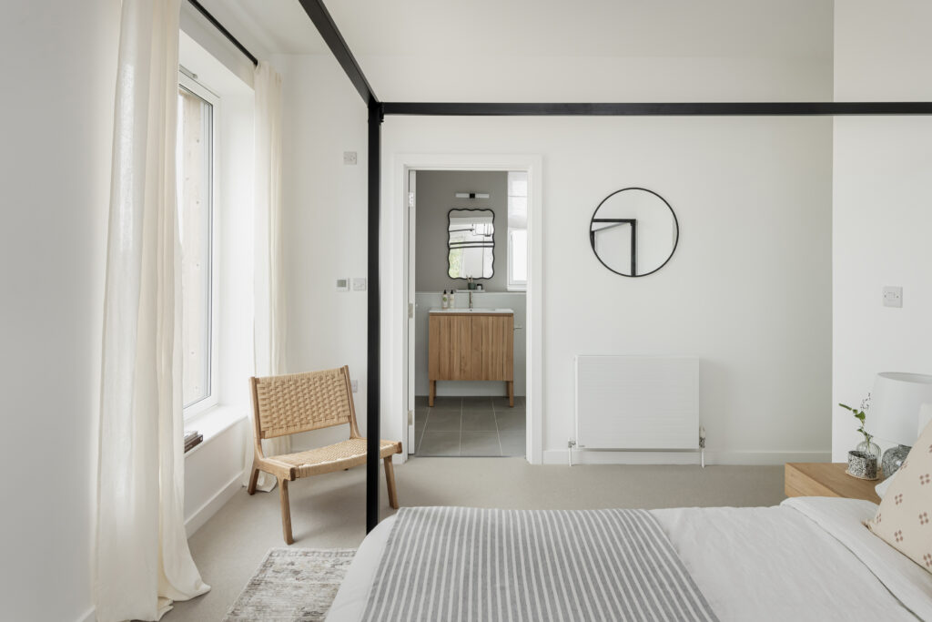 Bedroom interior with a view into the ensuite shower room
