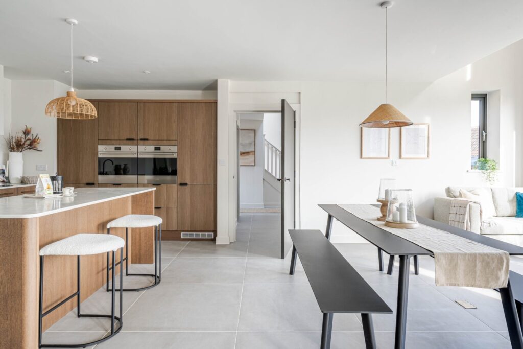Interior view of an open plan kitchen diner at The Farmyard in Grittleton, Wiltshire