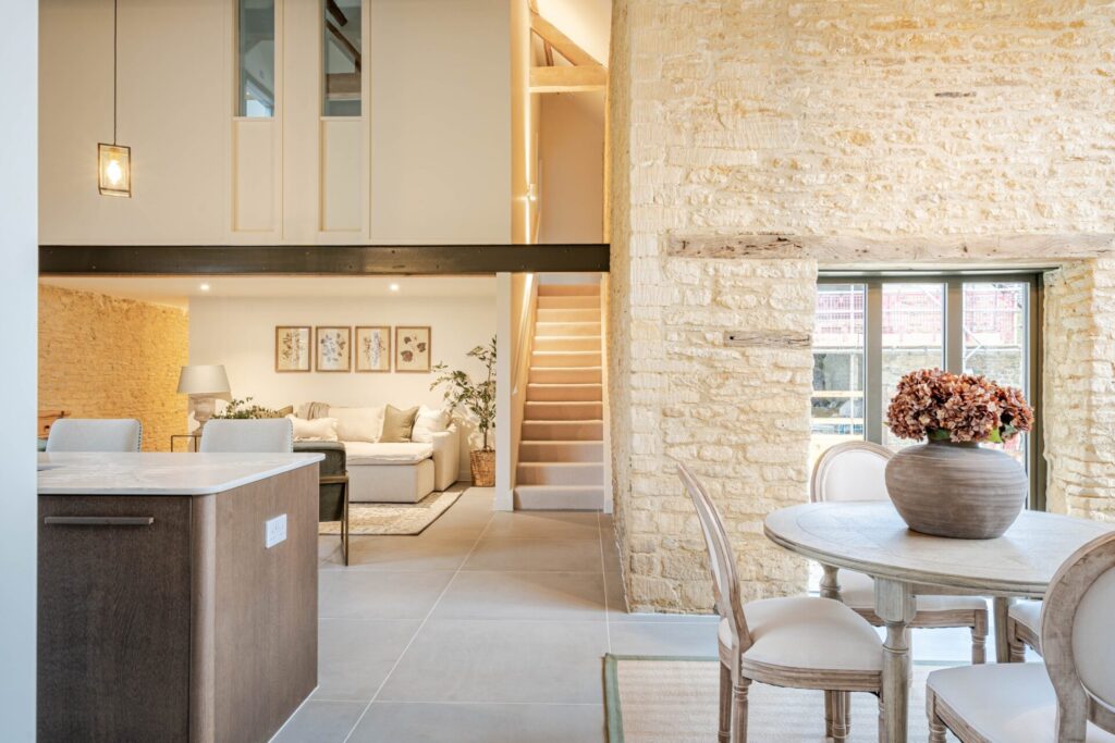 An open plan kitchen in a barn conversion at The Farmyard in Grittleton, Wiltshire